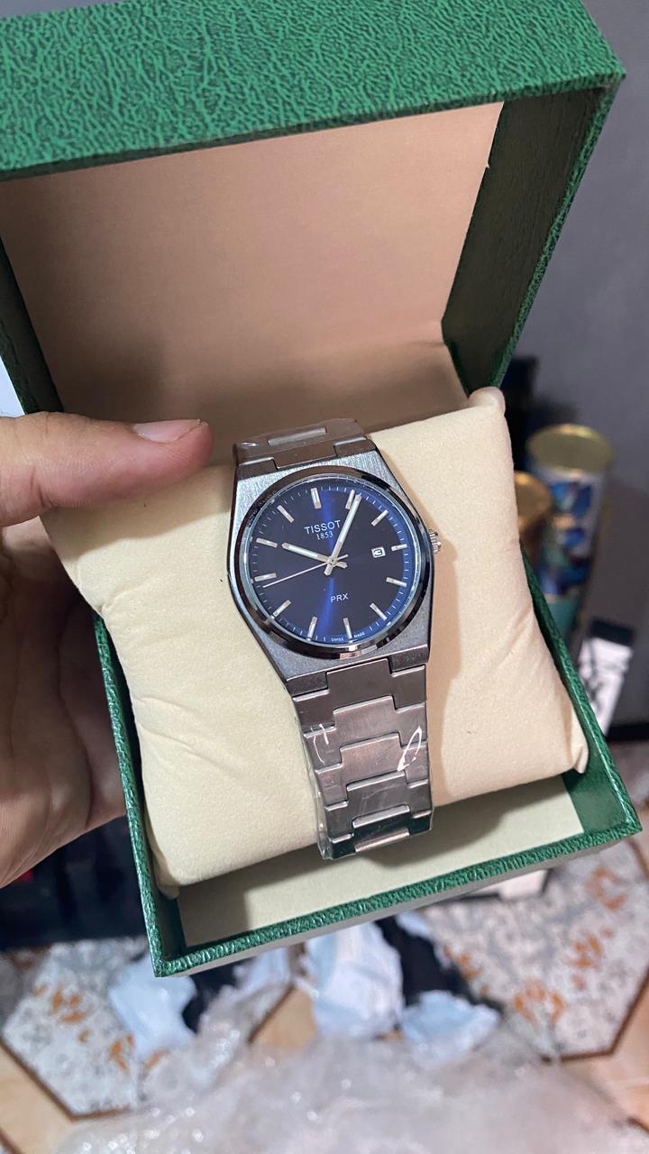 TISSOT ACIER GRIS TABLEAU BLEU